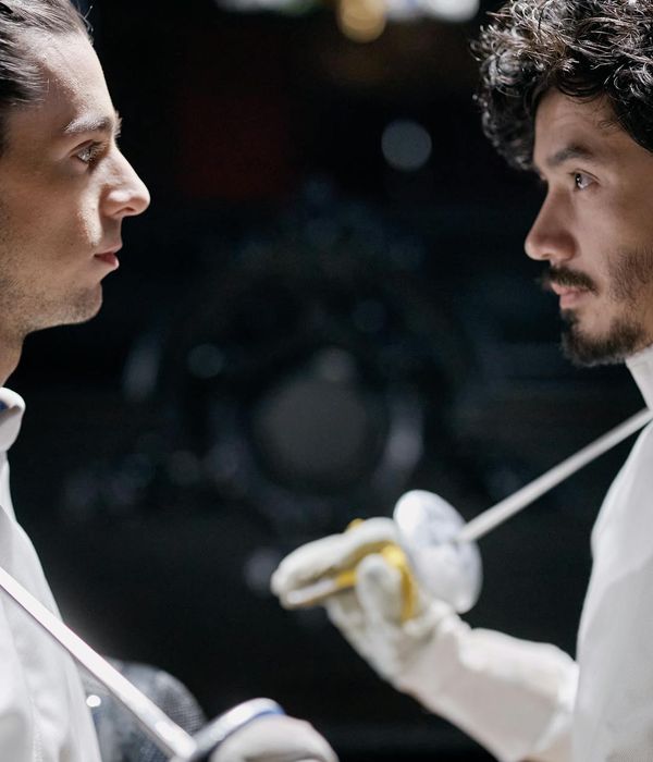 Man holding a difficult balance pose, showing focus and control.